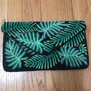 Palm beaded clutch. Optional silver strap. NWOT.